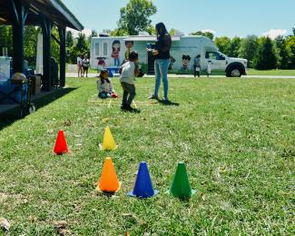 a photograph of children playing an outdoor game at the event