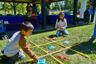 a photograph of children playing an outdoor game at the event